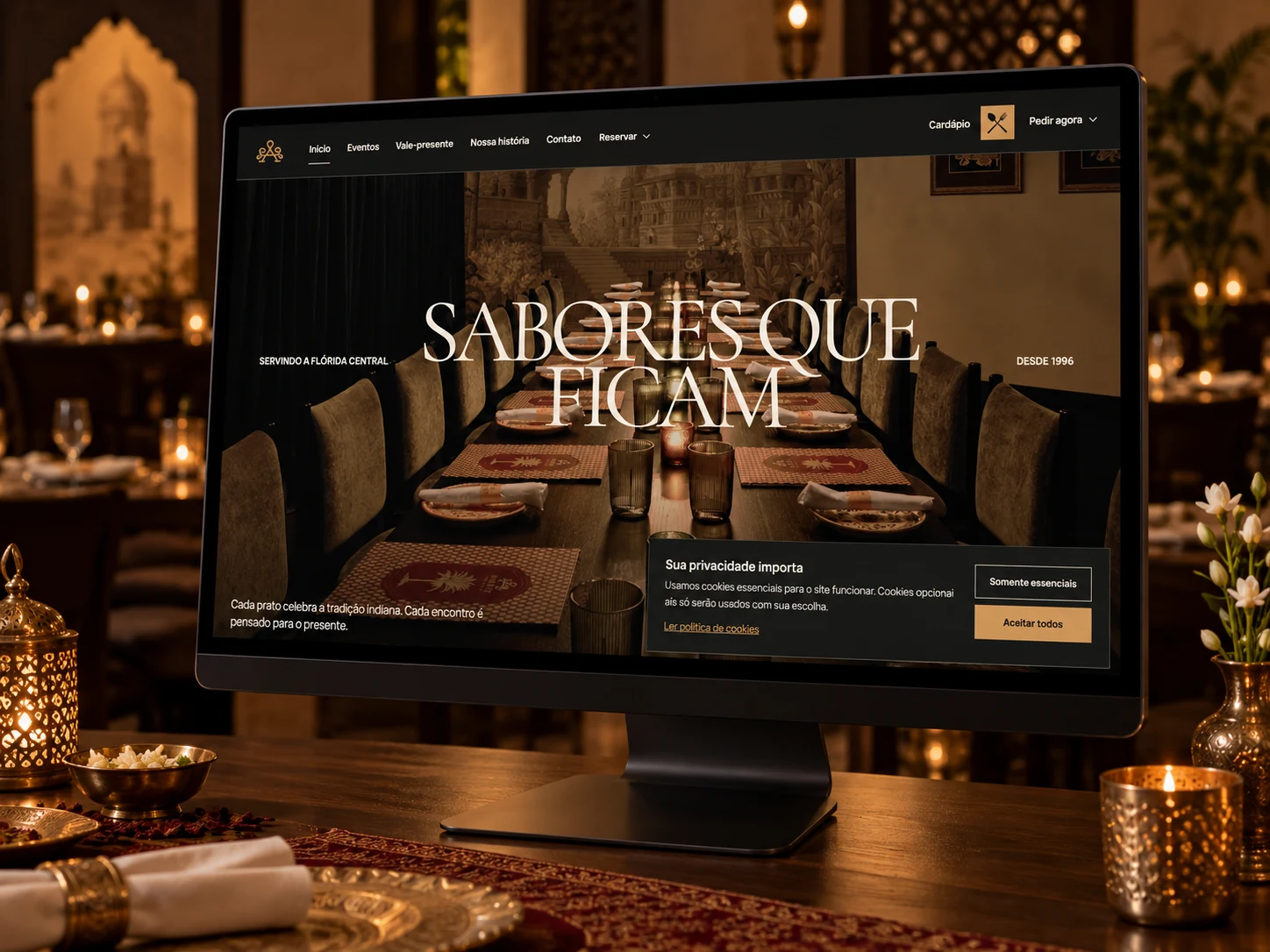 Projeto do site Amrit Palace exibido em um monitor dentro de um restaurante indiano